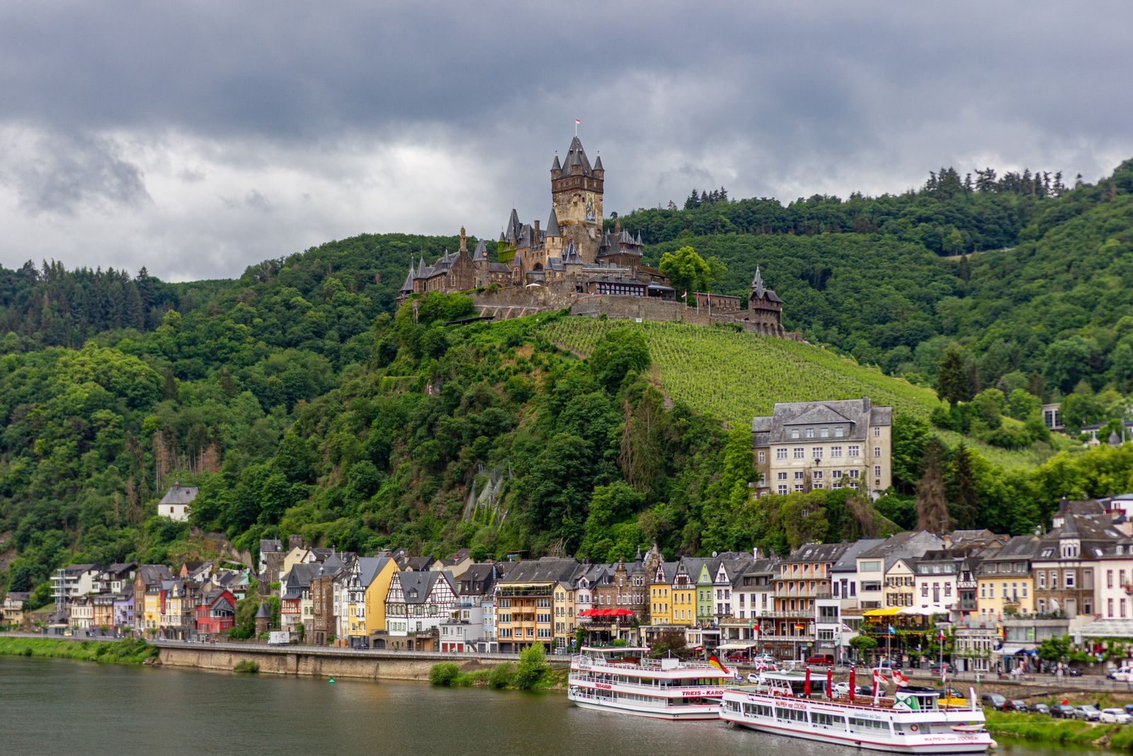 River cruise ships moored below Cochem Castle on the Moselle, a favorite route for the best river cruise deals