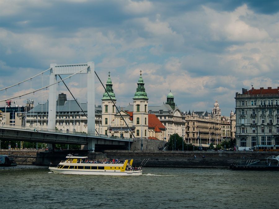 Riverboat passing under Elisabeth Bridge on the Danube in Budapest