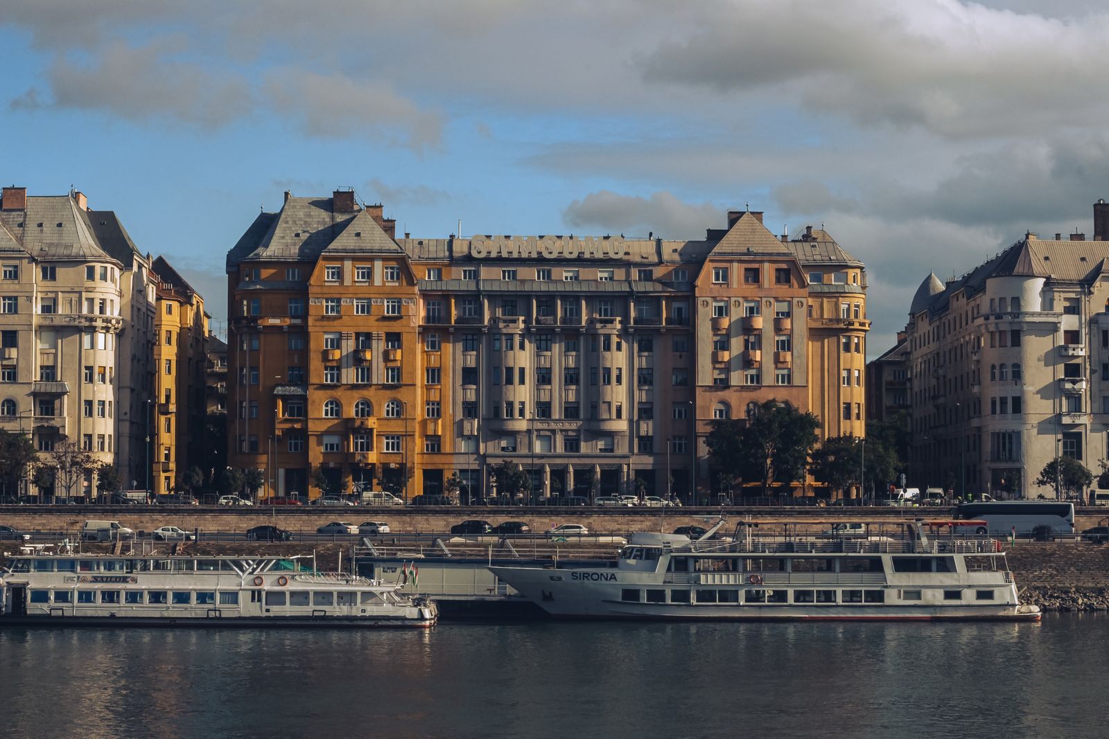 River cruise ships moored along the Danube embankment in Budapest, where many river cruise deals for 2026 sail late in the season